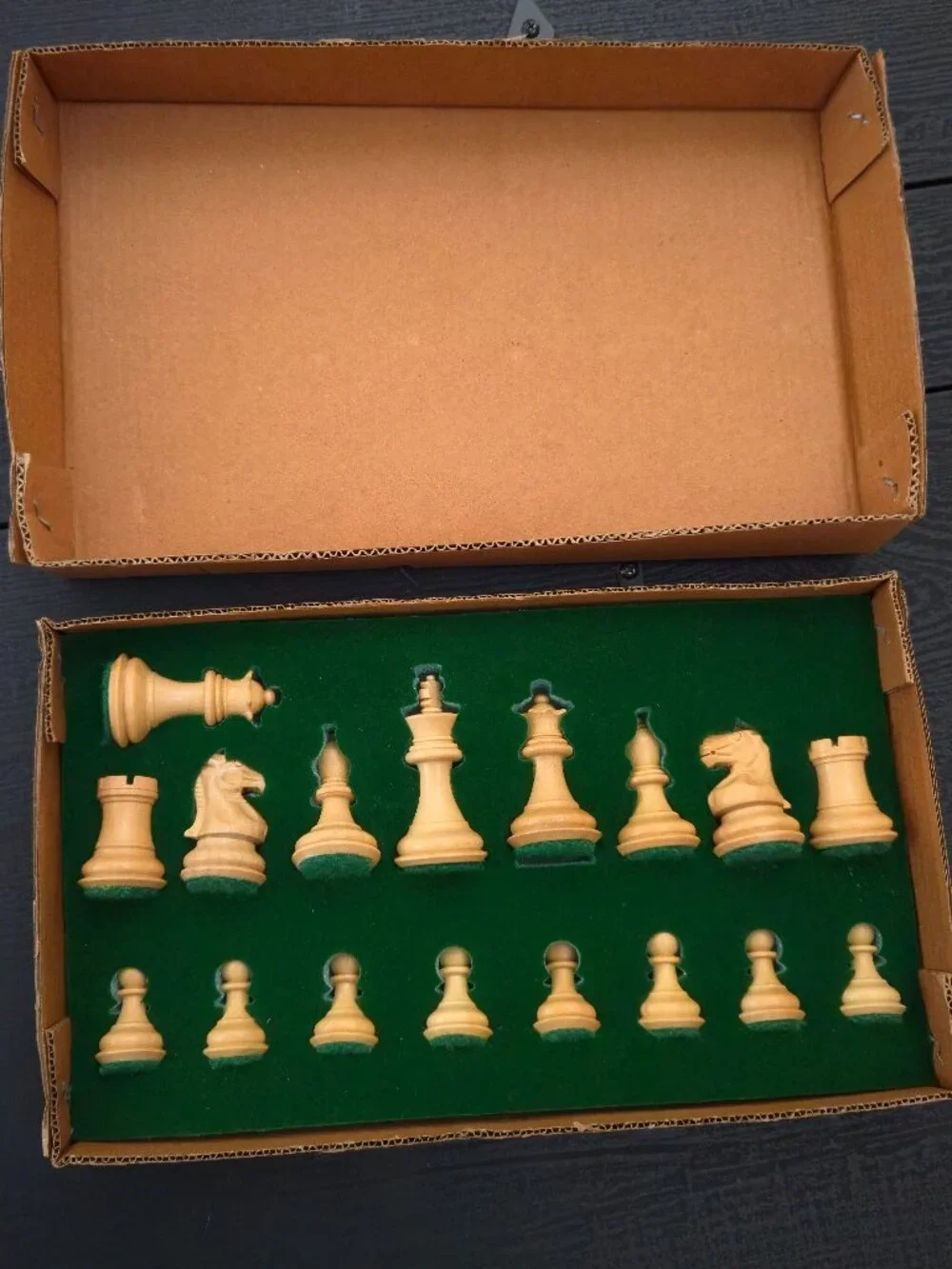 Vintage / new in holder. 17 piece wooden chess set with felt bottoms.